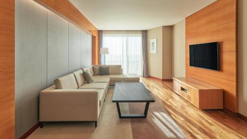 TV a/nebo společenská místnost v ubytování Mercure Ambassador Jeju