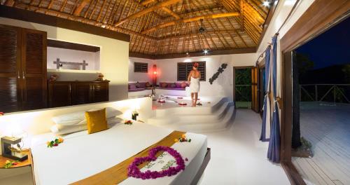 a bedroom with a large bed in a room at Navutu Stars Resort in Matayalevu