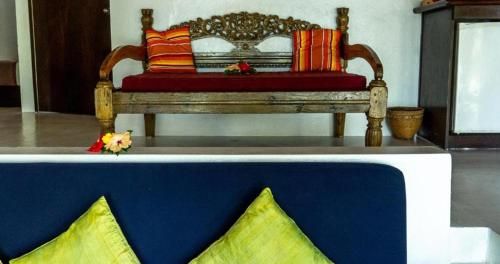 a bench with colorful pillows on top of a table at Navutu Stars Resort in Matayalevu