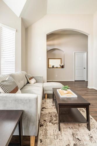 a living room with a couch and a table at Wonderful Getaway Cypress 2 BR with thoughtful comforts in Cypress