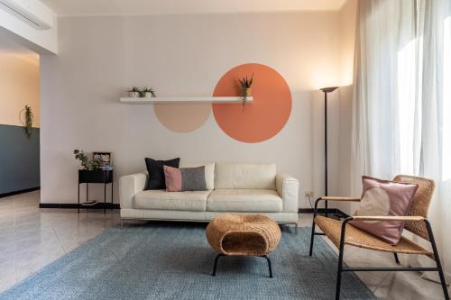 a living room with a couch and two chairs at A Tutto Tondo Apartment - Comfort and Style in Lerici in Lerici