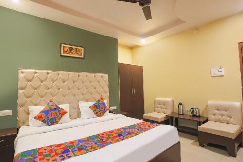 Ένα ή περισσότερα κρεβάτια σε δωμάτιο στο FabHotel DPS International