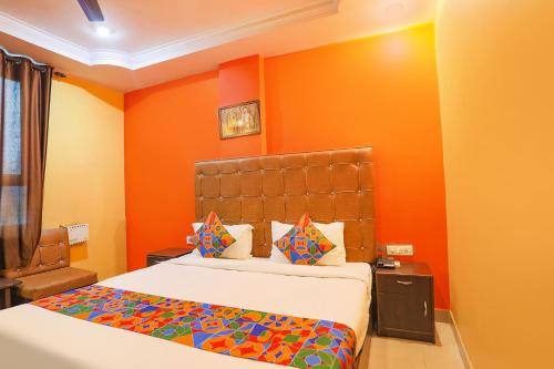 Ένα ή περισσότερα κρεβάτια σε δωμάτιο στο FabHotel DPS International