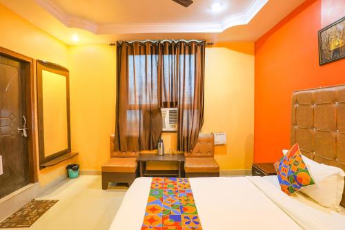 Ένα ή περισσότερα κρεβάτια σε δωμάτιο στο FabHotel DPS International