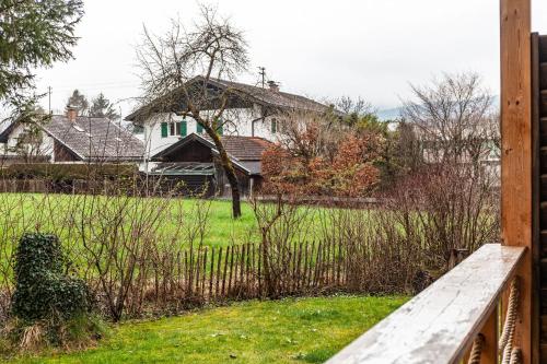 a wooden bridge over a yard with a house at Chalet Rauschn 1 in Farchant