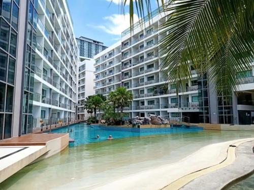 a swimming pool in the middle of a building at Laguna Beach Resort 1 by BPS in Jomtien Beach