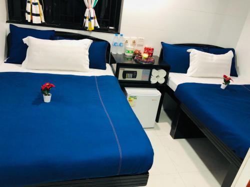 Letto o letti in una camera di Manila Lounge