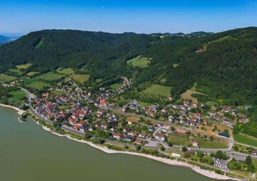 an aerial view of a town next to the water at Zu Hause am Bach in Aggsbach