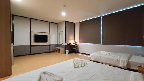 Кровать или кровати в номере Urban Inn, SP Saujana