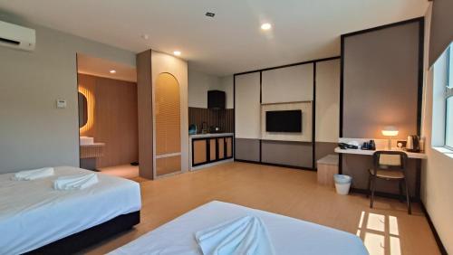 Кровать или кровати в номере Urban Inn, SP Saujana