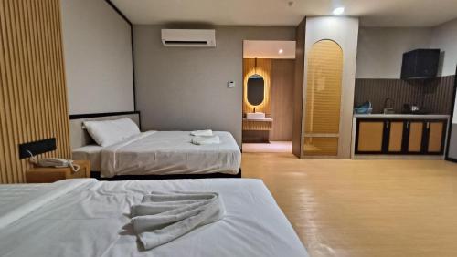 Кровать или кровати в номере Urban Inn, SP Saujana