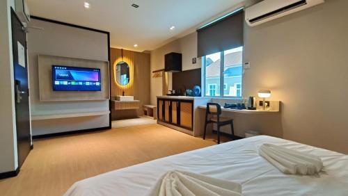 Телевизор и/или развлекательный центр в Urban Inn, SP Saujana