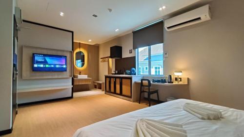 Кровать или кровати в номере Urban Inn, SP Saujana