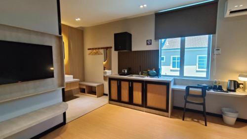Телевизор и/или развлекательный центр в Urban Inn, SP Saujana