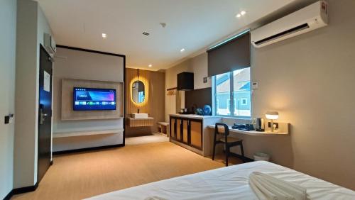 Кровать или кровати в номере Urban Inn, SP Saujana