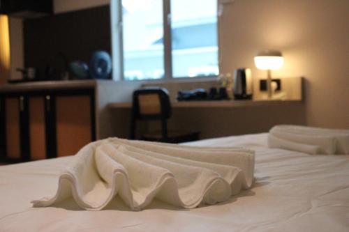 Кровать или кровати в номере Urban Inn, SP Saujana