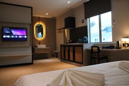 Кровать или кровати в номере Urban Inn, SP Saujana