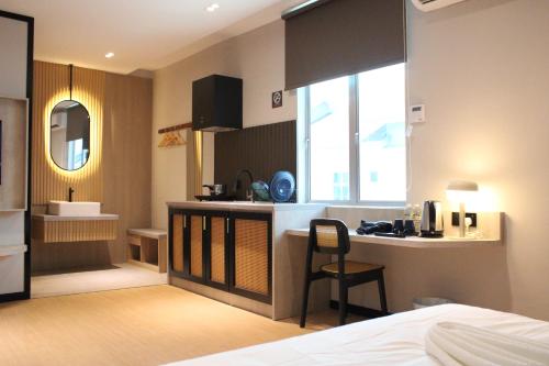 Кровать или кровати в номере Urban Inn, SP Saujana