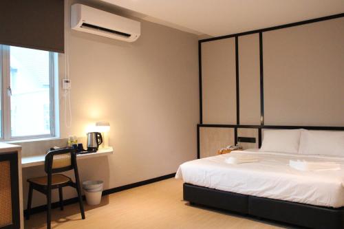 Кровать или кровати в номере Urban Inn, SP Saujana
