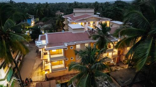 an overhead view of a building with palm trees at Kay's Calangute Resort Service Apartments in Calangute