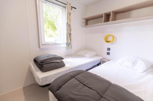 Postel nebo postele na pokoji v ubytování Camping Royal Ocean