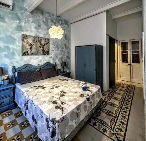 a bedroom with a large bed in a room at Townhouse 88 cloudy room in Sliema