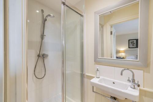 a bathroom with a shower and a sink at The Garden Room in Eastbourne