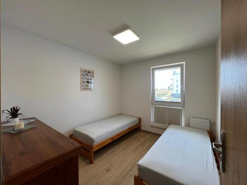 Postel nebo postele na pokoji v ubytování Apartament U Wujka Żukowo
