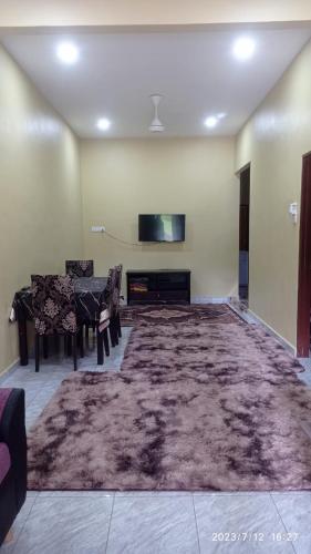 Μια τηλεόραση ή/και κέντρο ψυχαγωγίας στο homestay jalan baru sg duri