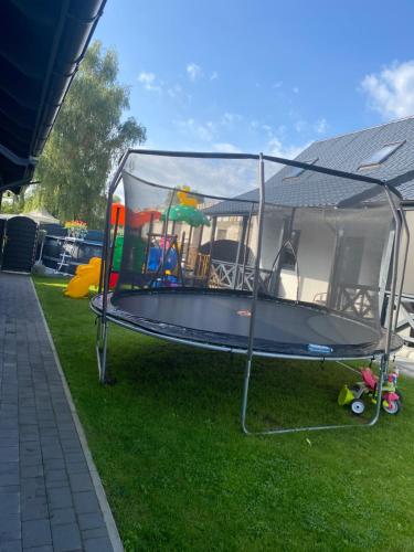 a trampoline in a tent on the grass at Domki Błażejewo in Łukęcin