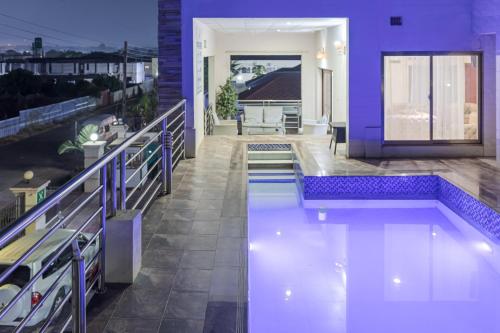 a house with a swimming pool on a balcony at The Crest Lodge Limited in Lusaka