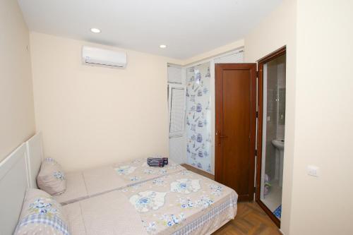 a small room with a bed and a bathroom at Sweet Home Shekvetili 1 in Shekvetili