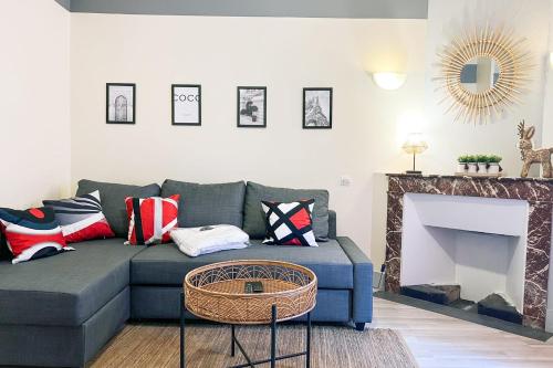 a living room with a couch and a fireplace at Marx Residence T2 4 personnes - Wifi #EA in Grenoble