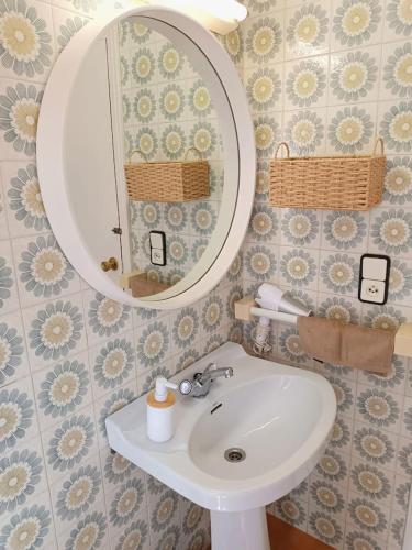 a bathroom with a sink and a mirror at Costa brava apartment, Estartit in Torroella de Montgrí