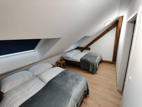 Postel nebo postele na pokoji v ubytování Amstetten Penthouse