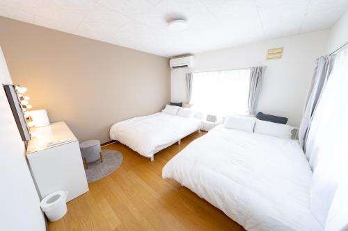Кровать или кровати в номере Furano Retreat