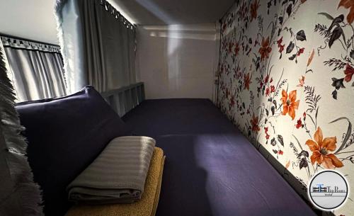 Säng eller sängar i ett rum på Tiny Room Hostel