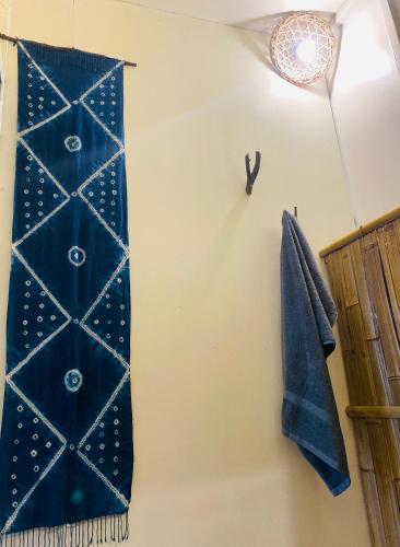 a blue towel is hanging on a wall at maison Rose & Jardinier eco homestay in Sa Pa