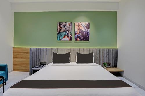 מיטה או מיטות בחדר ב-HOTEL LEE PLATINUM