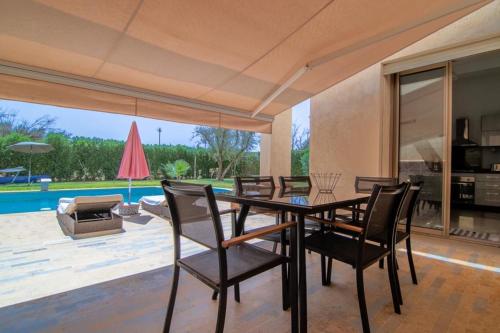 a dining room with a table and chairs at fleur de marrakech in Marrakesh