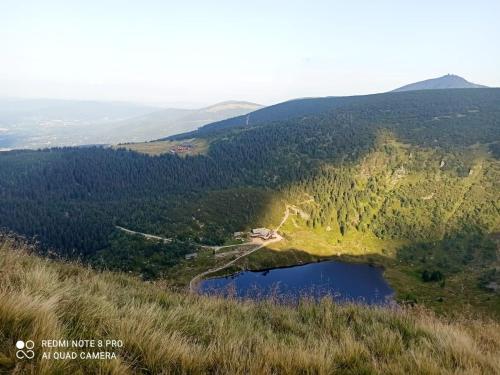 an aerial view of a lake on a hill at Apartament LILLA in Jelenia Góra