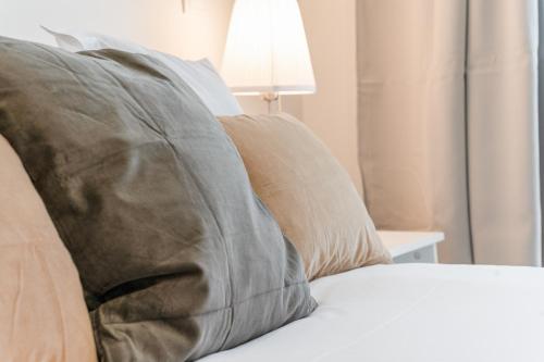 Un ou plusieurs lits dans un hébergement de l'établissement Elegant Belém Hideaway