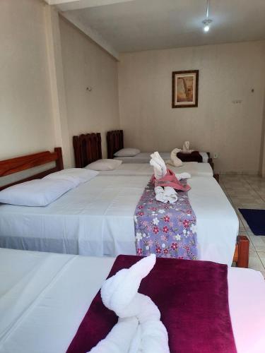 Postel nebo postele na pokoji v ubytování Hospedagem Serra da Lua