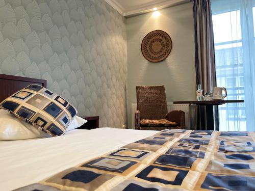 Кровать или кровати в номере African Sky Hotel