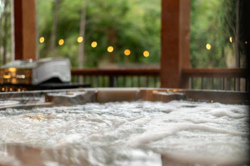 a close up of a counter top with a grill at Unwind in Style! *NEW* Sip and Stay Hideaway in Broken Bow