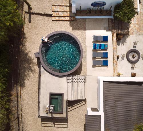 an overhead view of a swimming pool on a building at Mukti in Nieu-Bethesda