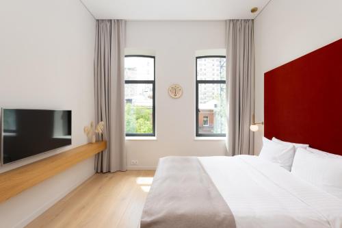 Una cama o camas en una habitación de Sophia Hotel Kyiv