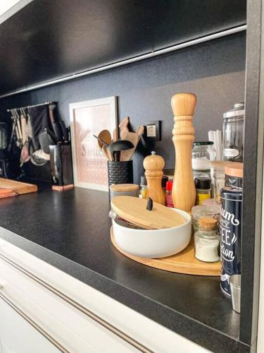 a counter top with a bowl and other kitchen items at Apartment *MALA* in Žalec