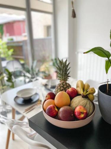 a bowl of fruit sitting on a table at Apartment *MALA* in Žalec