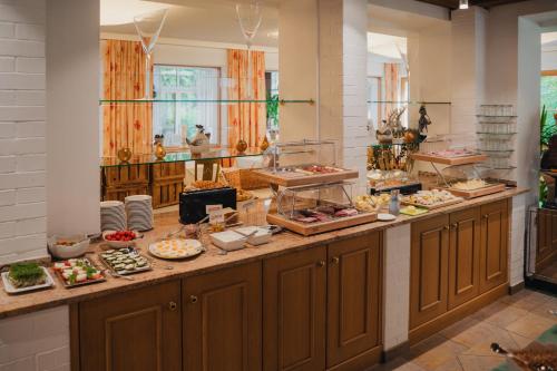 a buffet line with many different types of food at Relax- & Wanderhotel Poppengut in Hinterstoder